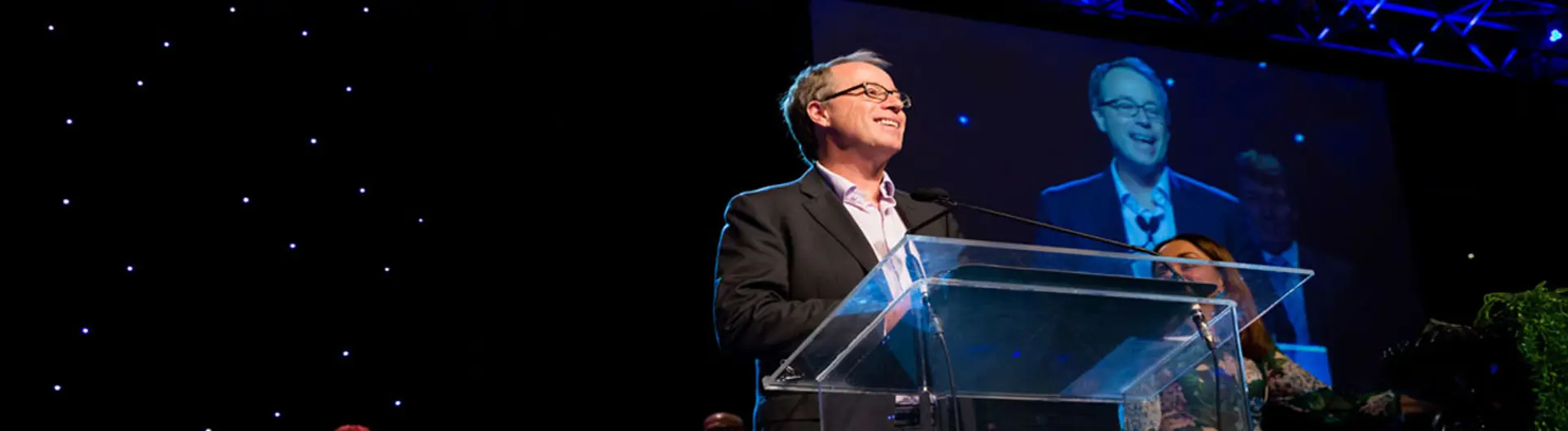 Dr Peter Cock (CEO)  accepting an award for Newcastle Airport