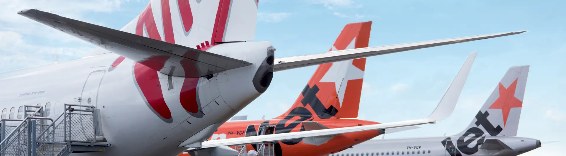 Virgin Australia and Jetstar aircraft on apron at Newcastle Airport