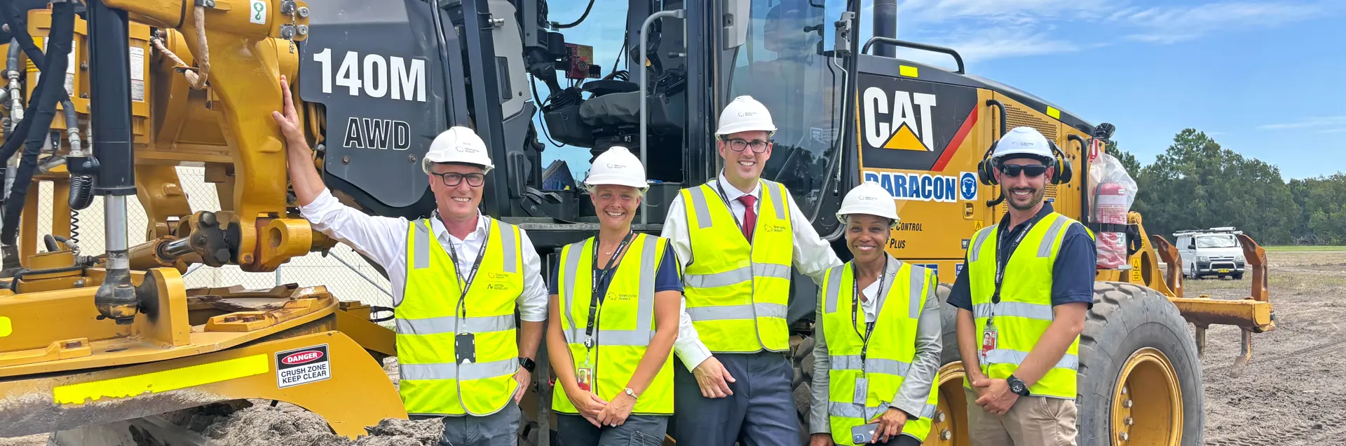 The Newcastle Airport team are celebrating the start of the airfield reconfiguration works.  (L-R)  Newcastle Airport: Executive GM Planning & Infrastructure Ben Kochanski, Contracts Manager  Catherine Gumley, Interim CEO Andrew Warrender, Senior Program Manager Raquel James-Wright, Project Manager Alistair Graham.