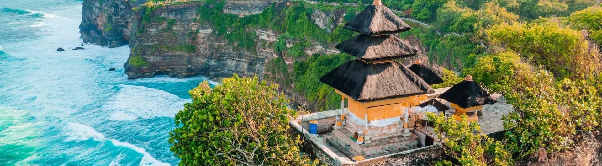An aerial view of a temple in Bali overlooking the ocean