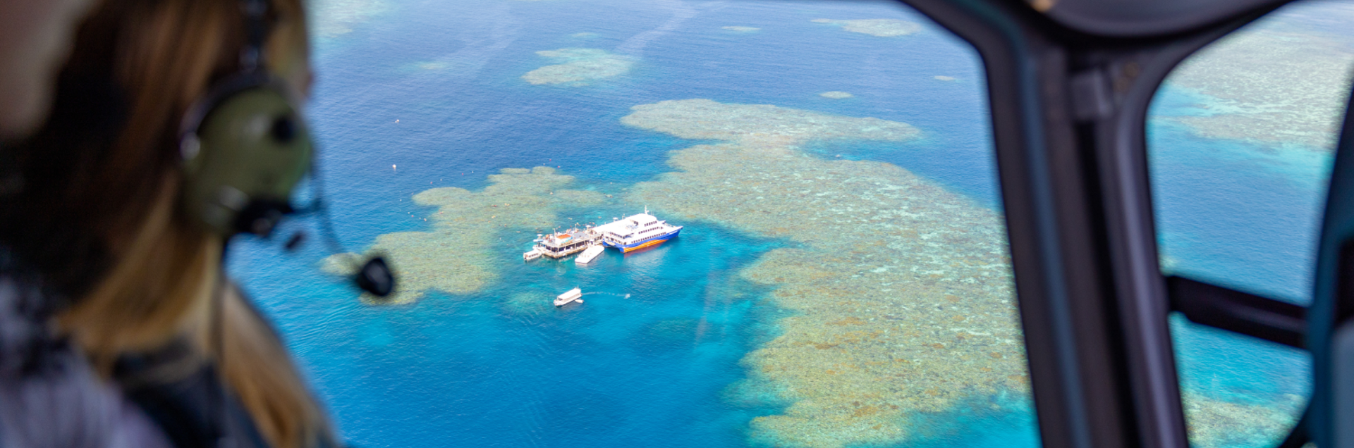 People flying over the Great Barrier Reef near Cairns