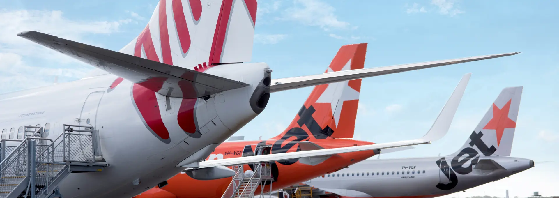Virgin Australia and Jetstar aircraft on apron at Newcastle Airport